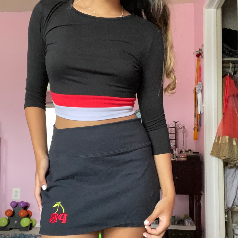 Black crop top with red and white lining